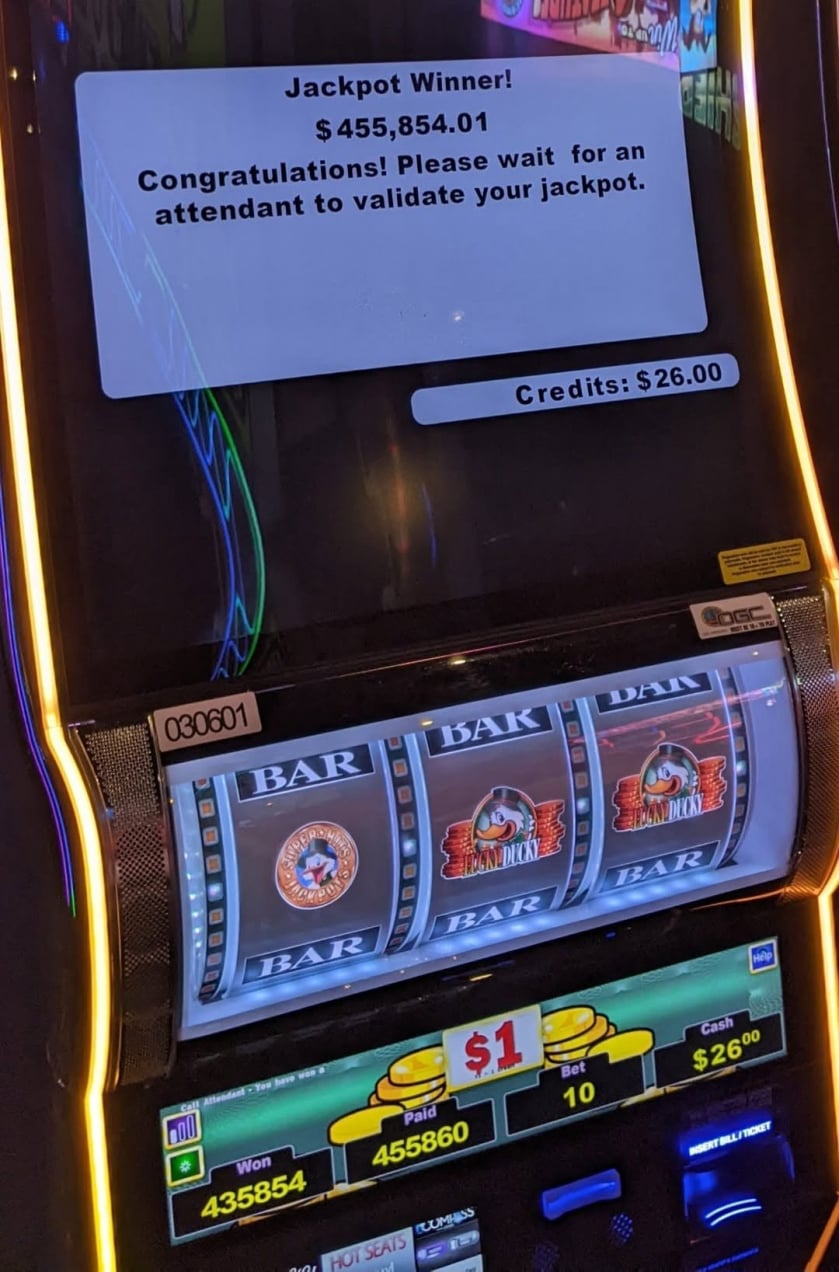 Lucky Ducky slot machine displaying a $455,854.01 jackpot win on a $10 bet, with $26.00 remaining in credits at High Winds Casino in Miami, Oklahoma.